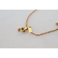 Dolce & Gabbana Elegant Gold Tone Charm Necklace with Cross Pendant